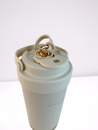 Insulating coffee mug with opening